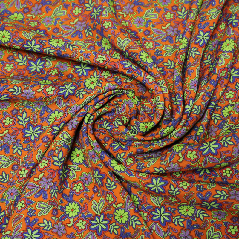 Étoffe 100% viscose - Fleur violette fond orange