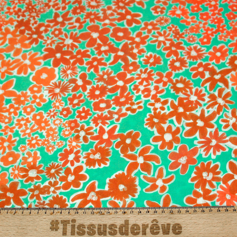 Étoffe 100% viscose - Fleur orange fond vert
