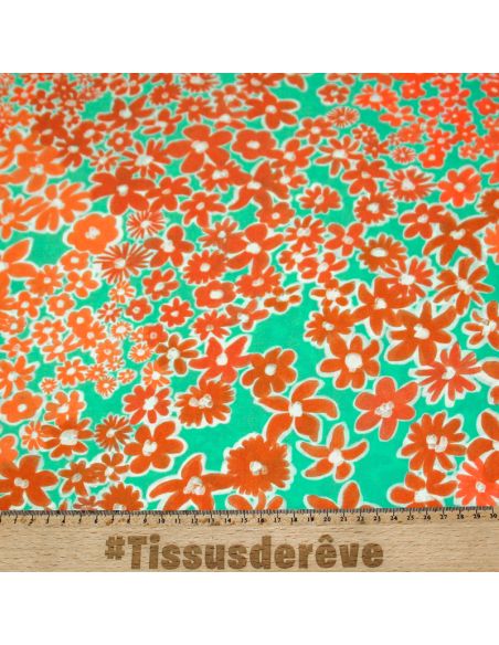 Étoffe 100% viscose - Fleur orange fond vert