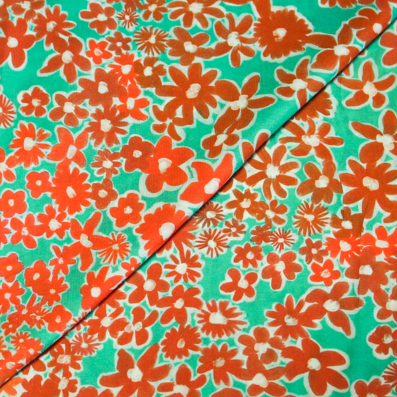 Étoffe 100% viscose - Fleur orange fond vert