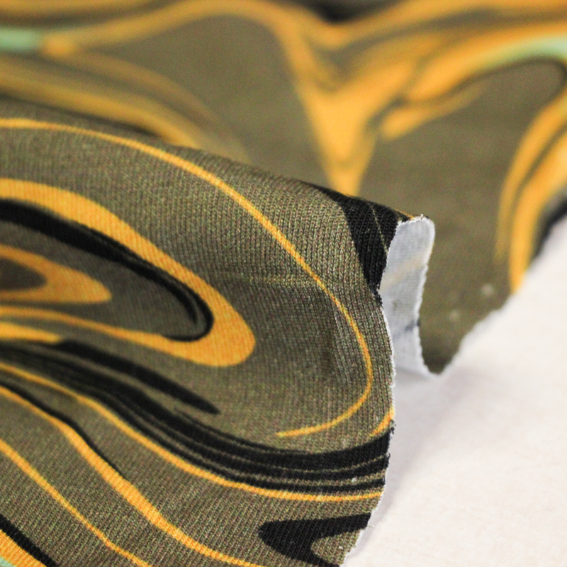 Jersey coton peigné & élasthanne – Marbré jaune vert noir