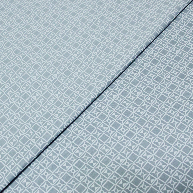 Gabardine coton & élasthanne - Motif géométrique fond bleu