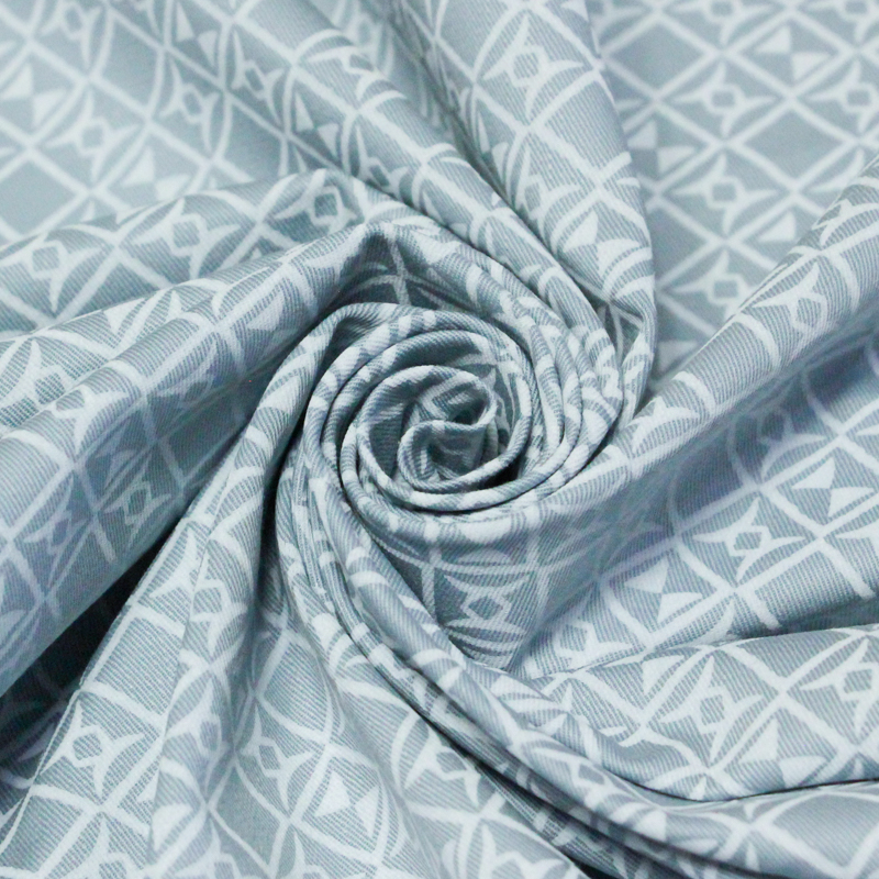 Gabardine coton & élasthanne - Motif géométrique fond bleu