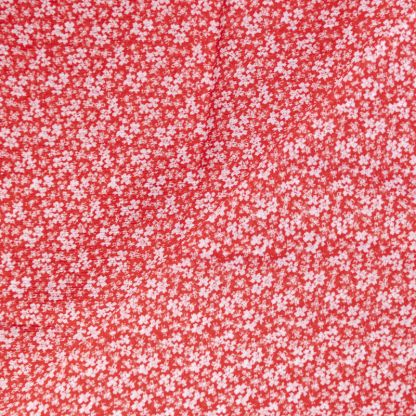 Mousseline crinkle 100% viscose – Fleurs blanches sur fond rouge