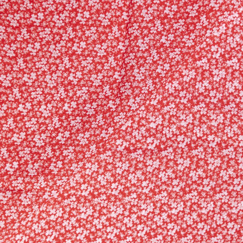 Mousseline crinkle 100% viscose – Fleurs blanches sur fond rouge