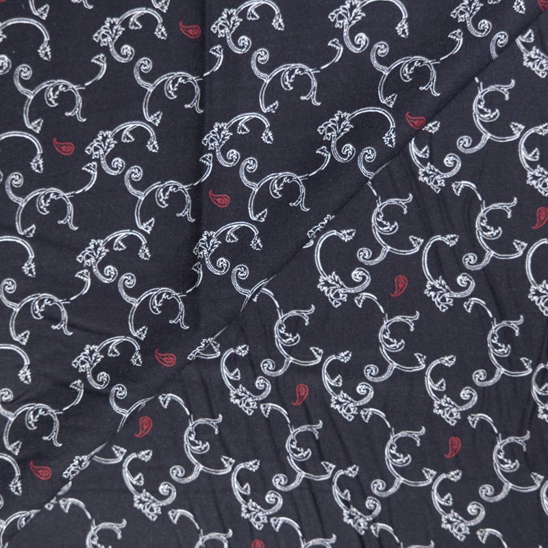 Twill 100% viscose – Arabesques blanches et cachemires rouges sur fond noir