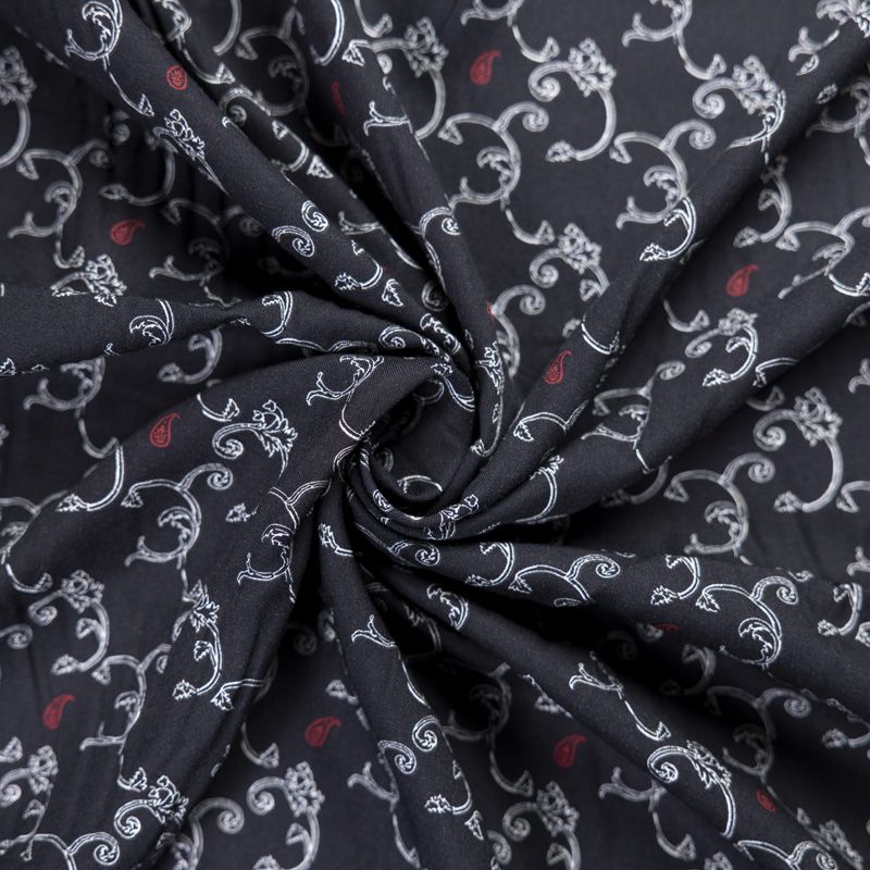 Twill 100% viscose – Arabesques blanches et cachemires rouges sur fond noir