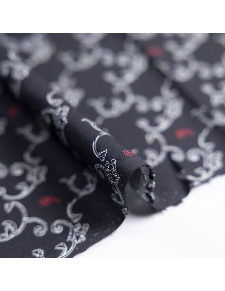 Twill 100% viscose – Arabesques blanches et cachemires rouges sur fond noir