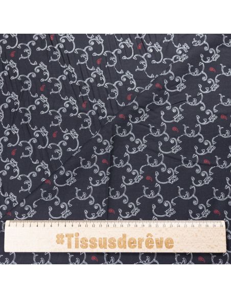 Twill 100% viscose – Arabesques blanches et cachemires rouges sur fond noir
