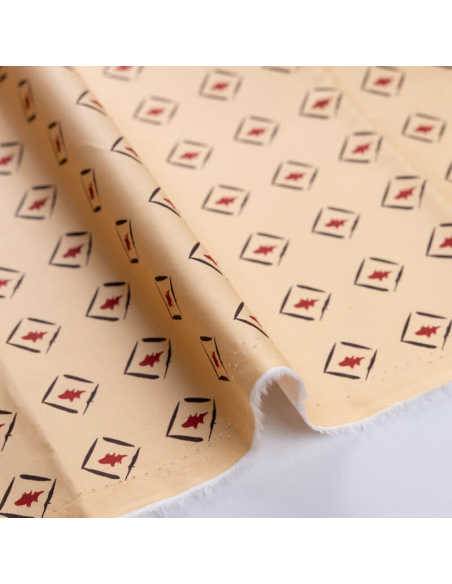 Popeline coton & élasthanne – Losanges graphiques rouge fond beige